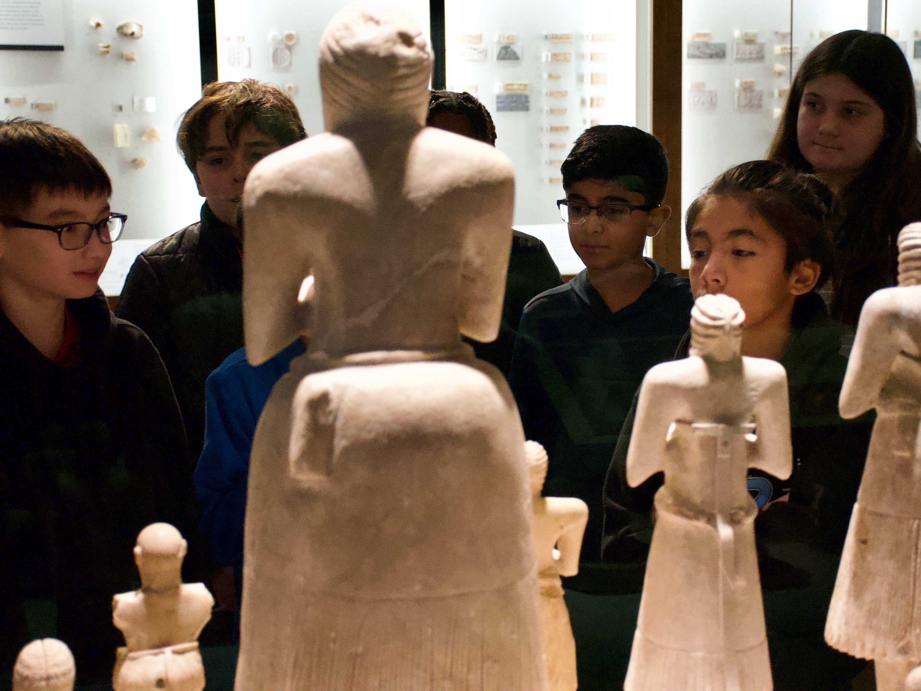 Chicago City Day School looking Sumerian worshipper statues.